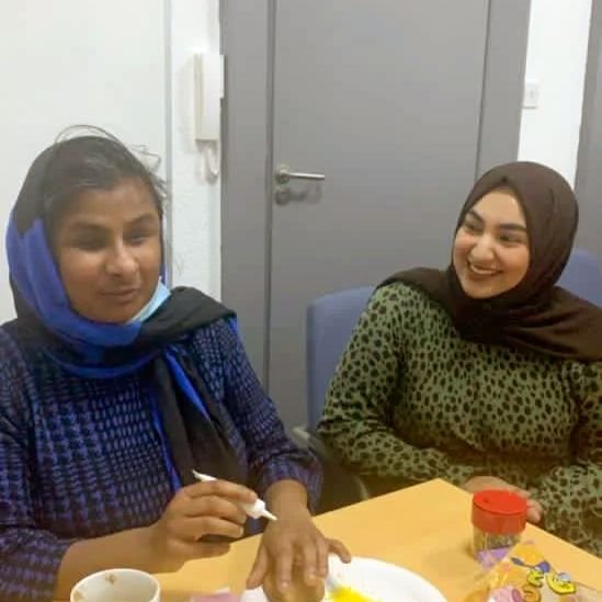 Two people talking at a table