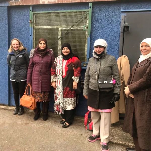 A group outside a community building
